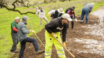 A group of trail masters volunteers work on a trail at Coyote Valley Open Space Preserve