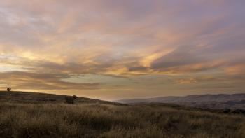 A cloudy sky over the Santa Teresa Foothills