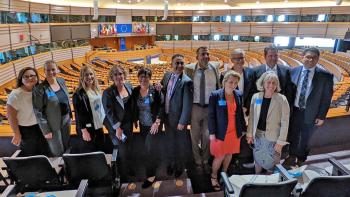 Andrea Mackenzie poses for a photo with Silicon Valley leaders and French delegation